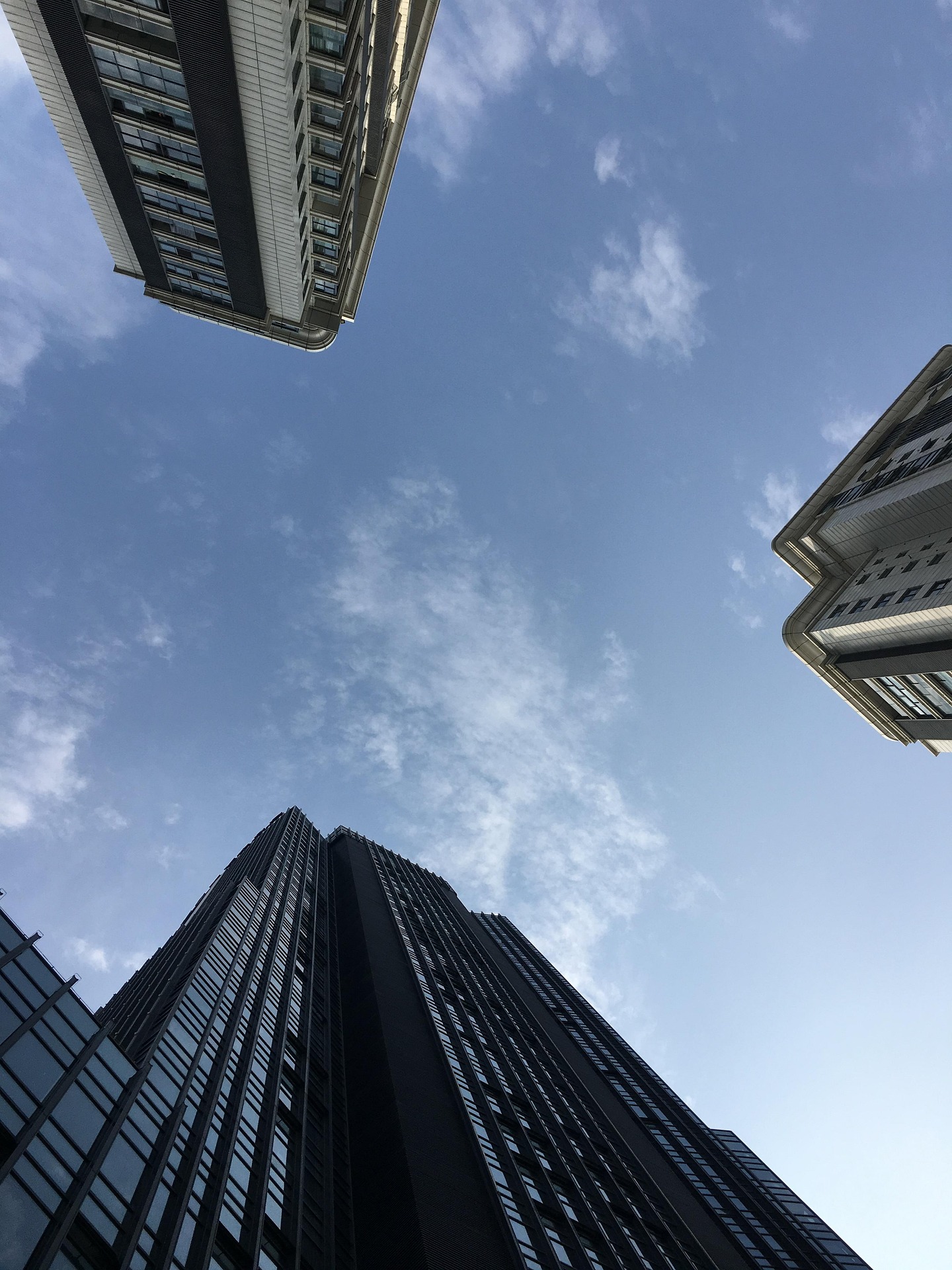 High-rise glazed building facade — floor-to-ceiling curtain wall