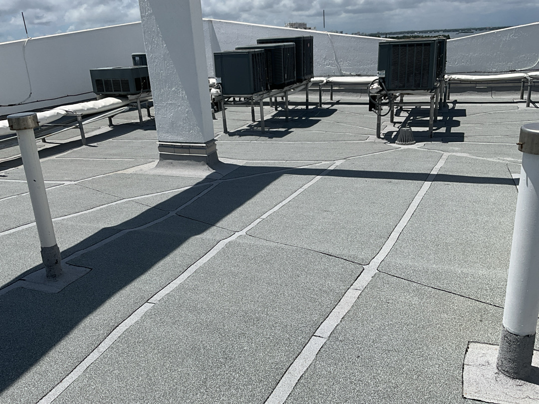 Commercial flat roof inspection — modified bitumen with HVAC equipment
