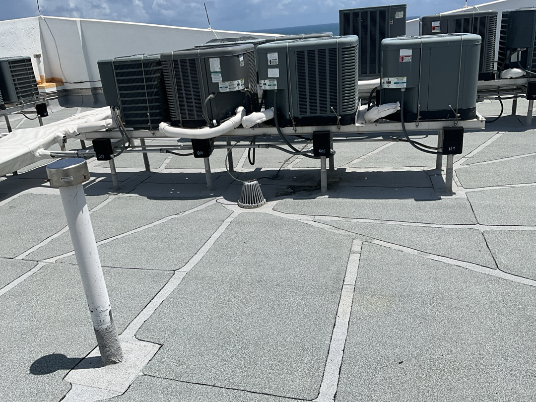 Commercial rooftop with HVAC equipment — load and attachment review
